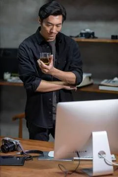 Photographer using computer in studio Stock Photos