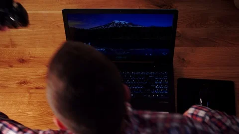 Photographer using Dslr camera and laptop to download his files to the computer. Stock Footage 116124258