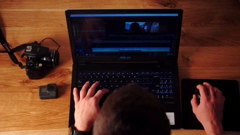 Photographer using Dslr camera and laptop to download his files to the computer. Stock Footage 116126539