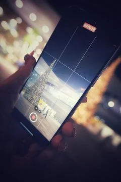 Photographer using a phone 库存照片