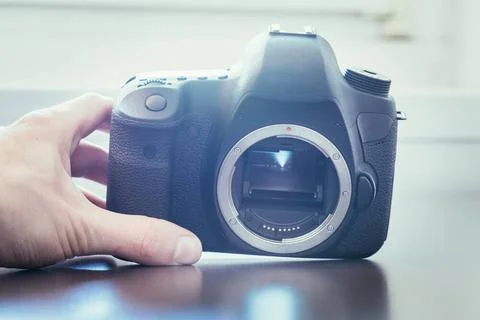 Photographer is using a professional camera, open sensor Hands of a photog... Stock Photos