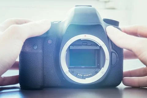 Photographer is using a professional camera, open sensor Hands of a photog... Stock Photos
