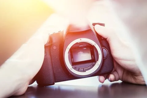 Photographer is using a professional camera, open sensor and sunlight Hand... Stock Photos
