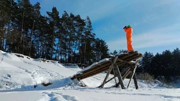 Photographer using a strange wooden construction for photographing Stock Footage 86012001