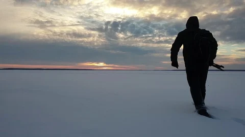 The photographer is walking in the snow. Stock Footage 101393180