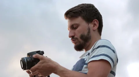 Photographer at work with camera outdoor Stock Footage 65504902