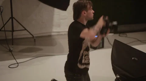 Photographer work in studio Stock Footage 34200674