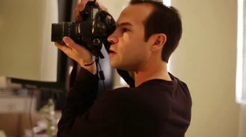 Photographer Working and Directing Model - Hand Held Shot Stock Footage 20606127