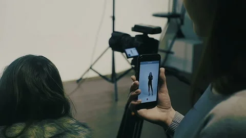 Photographer working with model in studio Slow Motion Stock Footage 85794074