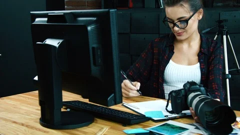 Photographer working in office Stock Footage 92109887