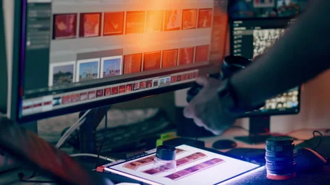 Photographer Workstation with Camera Lens and Analog Film Light Table, Close Up Stock Footage 346407407