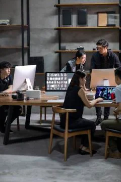 Photographers working in studio Stock Photos
