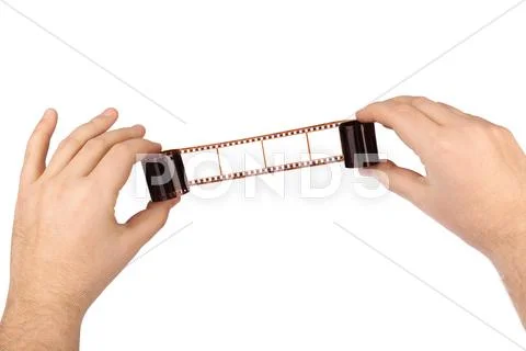 Photographic film in hands Stock Photos