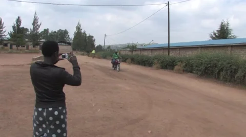 Photographing a motorcycle in Rwanda Stock Footage 45434560