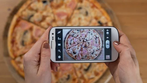 Photographing Pizza Using a Smartphone Cell phone. Close-Up Of Hands Taking Pict Stock Footage 124788408