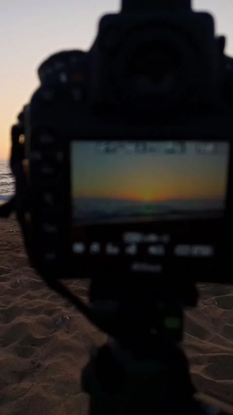 Photographing a sunset at the beach Stock Footage 202911655