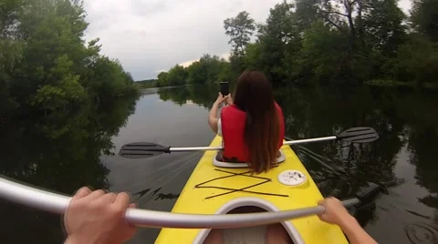 Photography in the canoe while sailing on the river in the beautiful green water Stock Footage 64233321