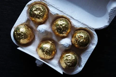 Photography of chocolate easter eggs wrapped in gold foil for food illustra.. Stock Photos