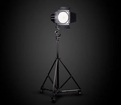 Photography studio flash on a lighting stand isolated on black background. Stock Photos