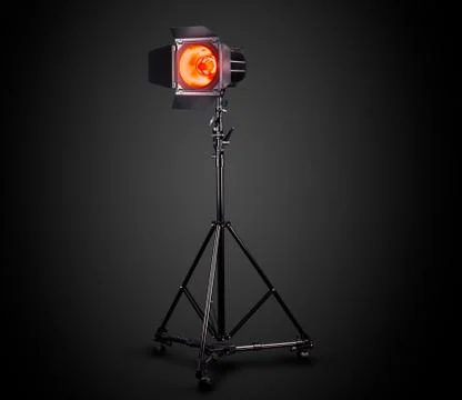 Photography studio flash on a lighting stand isolated on black background. Foto stock