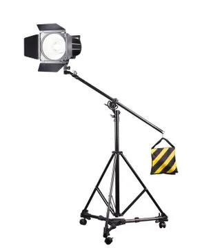Photography studio flash on a lighting stand isolated on white background. Stock Photos