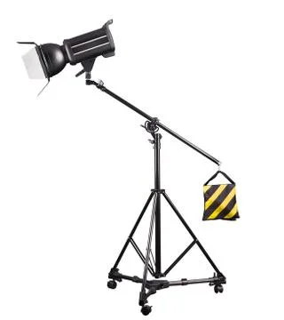 Photography studio flash on a lighting stand isolated on white background. Stock Photos
