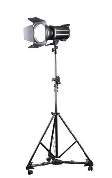 Photography studio flash on a lighting stand isolated on white background. Stock Photos