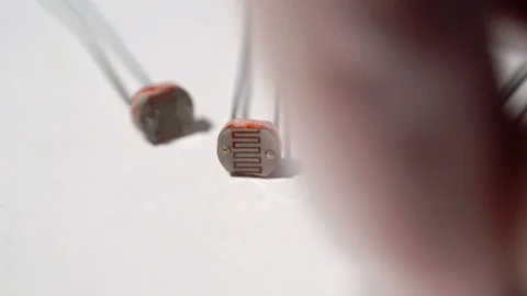 Photoresistor for detecting light. Electronics components for diy engineering Stock Footage 129717676