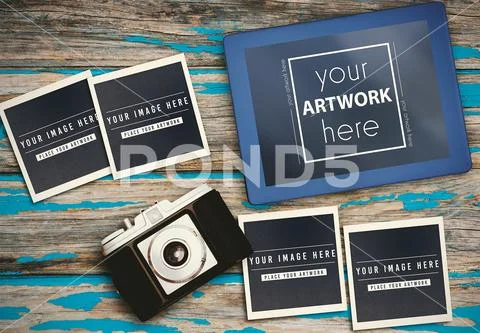Photos with camera and digital tablet on wooden table PSD Template