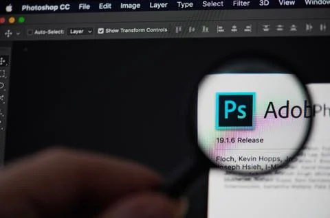 Photoshop application icon view throw magnifier Stock Photos