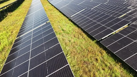 Photovoltaic panel array in countryside setting from above Stock Footage 348389084