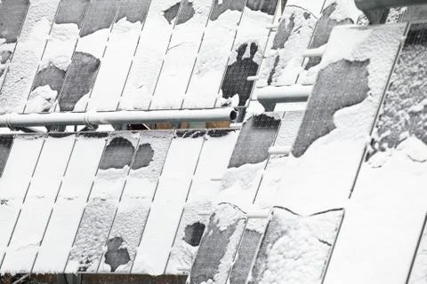 Photovoltaic panel covered by snow Stock Photos
