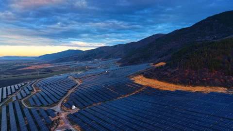 Photovoltaic solar array on hillside during blue hour twilight Video stock 328993111