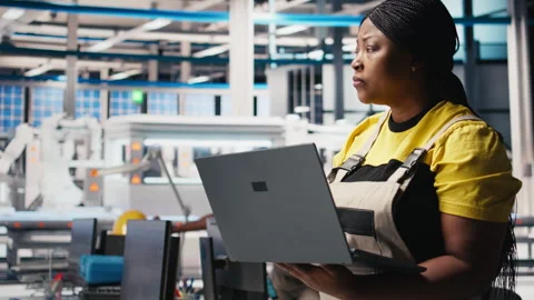 Photovoltaics factory engineer using laptop to do performance testing Stock Footage 309075493