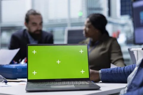 Photovoltaics factory managers analyzing data using green screen laptop Stock Photos