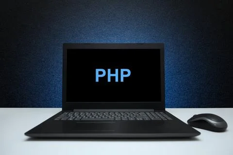 PHP text on laptop screen on textured black background with blue light. 스톡 사진
