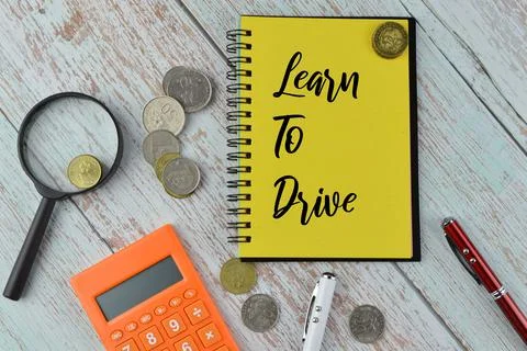 Phrase LEARN TO DRIVE written on notebook. Foto stock