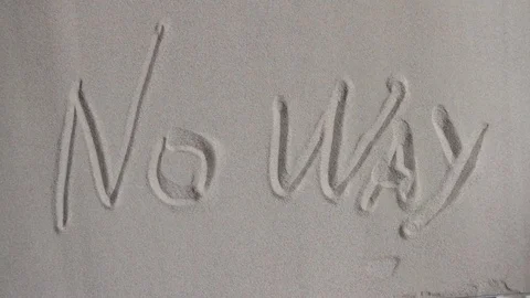 The phrase "no way" written in the sand slowly crumbles down Stock Footage 80050201