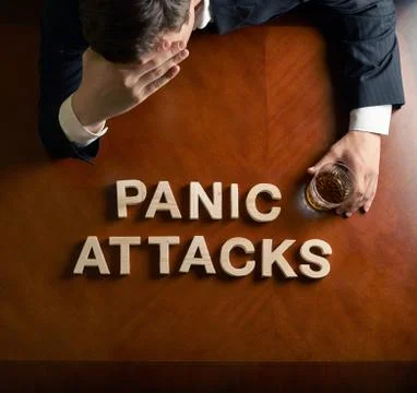Phrase Panic Attacks and devastated man composition 스톡 사진