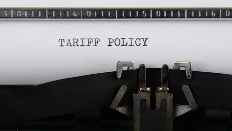 The phrase TARIFF POLICY is typing on a retro typewriter.	 Stock Footage 314581082