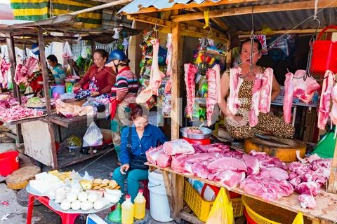 Phu Quoc Island, Vietnam - February 26, 2018: Street woman vendors sell meat on Stock Photos
