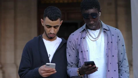 Phubbing concept: people at a table using their mobile phones Stock Footage 218586442