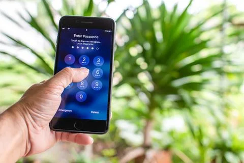 Phuket, Phi Phi, Thailand Oct 8, 2020: Hand holding Apple iPhone 7 plus in bl Foto stock