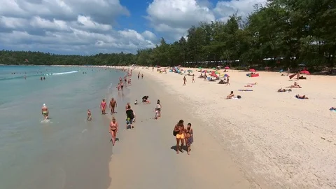 PHUKET, THAILAND - 20 JAN 2017: Fly above the Kata beach in Phuket, where people Stock Footage
