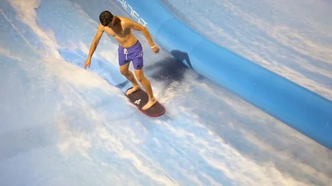 PHUKET, THAILAND May 12, 2017: The flow rider man is surfing at surf machine. Stock Footage