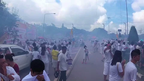 PHUKET, THAILAND October 7, 2016: Vegetarian festival. Firecrackers street war. Stock Footage 70059341