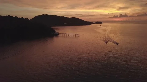 Phuket's sunset sky with local fishing boat passed by Stock Footage