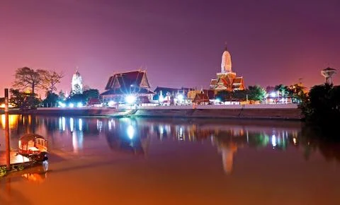 Phutthaisawan temple at night time with reflection on river view from river s Stock Photos