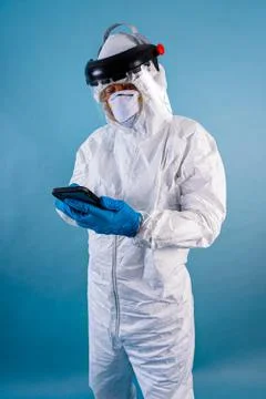 A phyisician checking his while on stand-by during the coronavirus 2020 pandemic Stock Photos