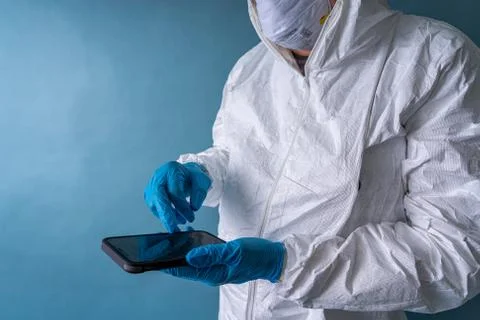 A phyisician checking his while on stand-by during the coronavirus 2020 pandemic Stock Photos